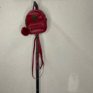 Elegant Red Backpack with Pom Pom Charm